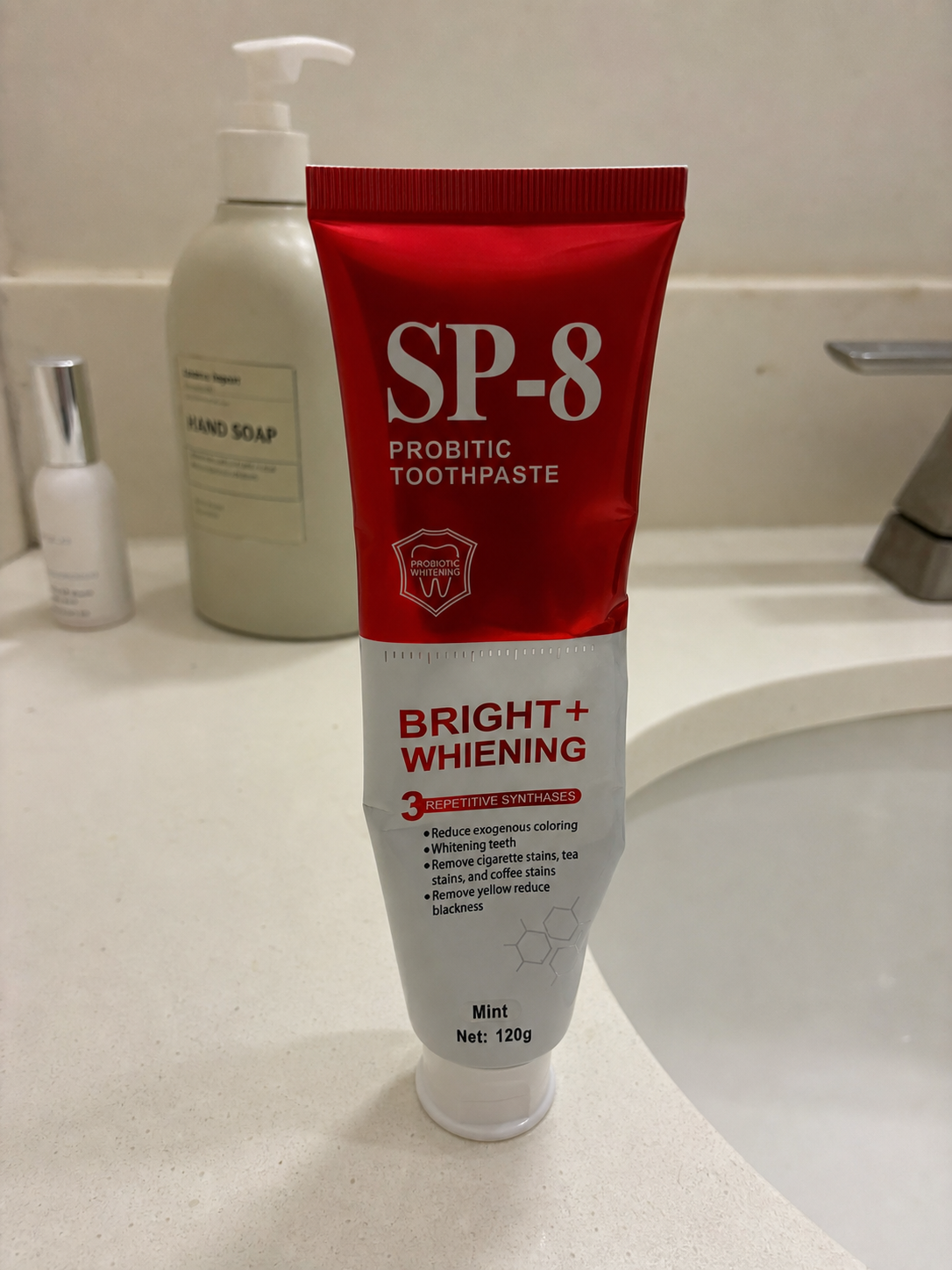 Demo customer photo of a lightly used SP-8 toothpaste tube on a bathroom counter