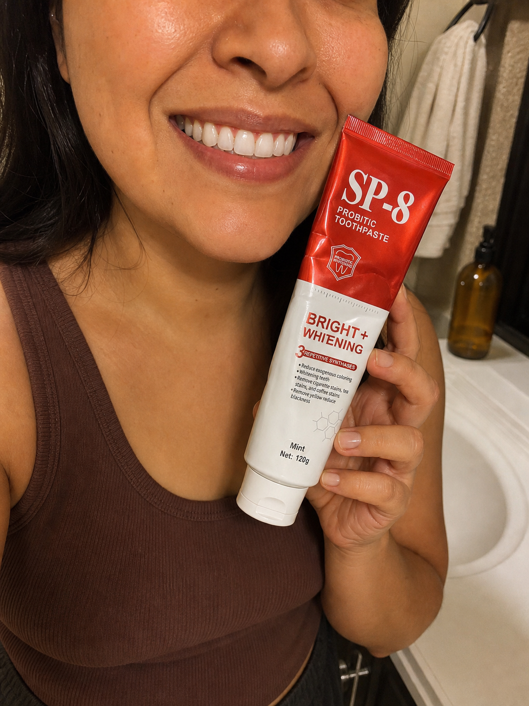 Teaching-demo customer photo of a Latina woman showing her smile and SP-8 toothpaste